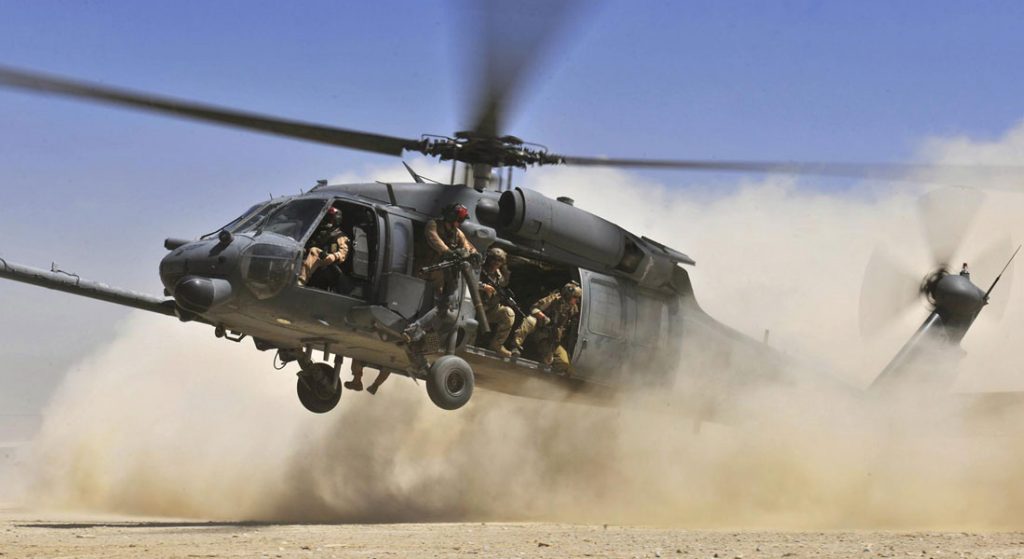 USAF Pave Hawk landing on dirt tarmac