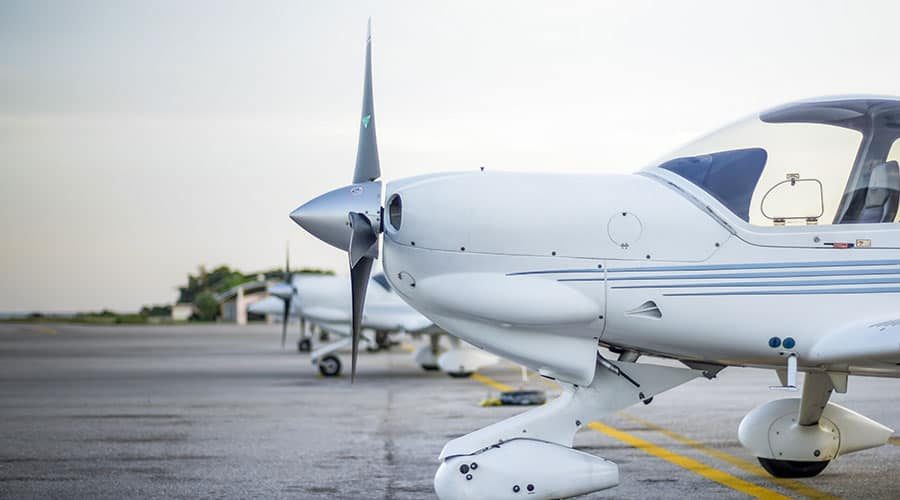 Diamond aircraft parked on runway